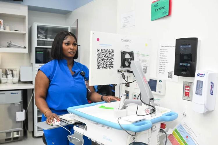 Pediatric healthcare professional reviewing electronic health record information at Children’s Healthcare of Atlanta Arthur M. Blank Hospital. (Photo courtesy of Children's Healthcare of Atlanta)